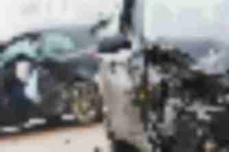 Two vehicles with severe front-end collision damage and deployed airbag, evidence for a car accident injury claim